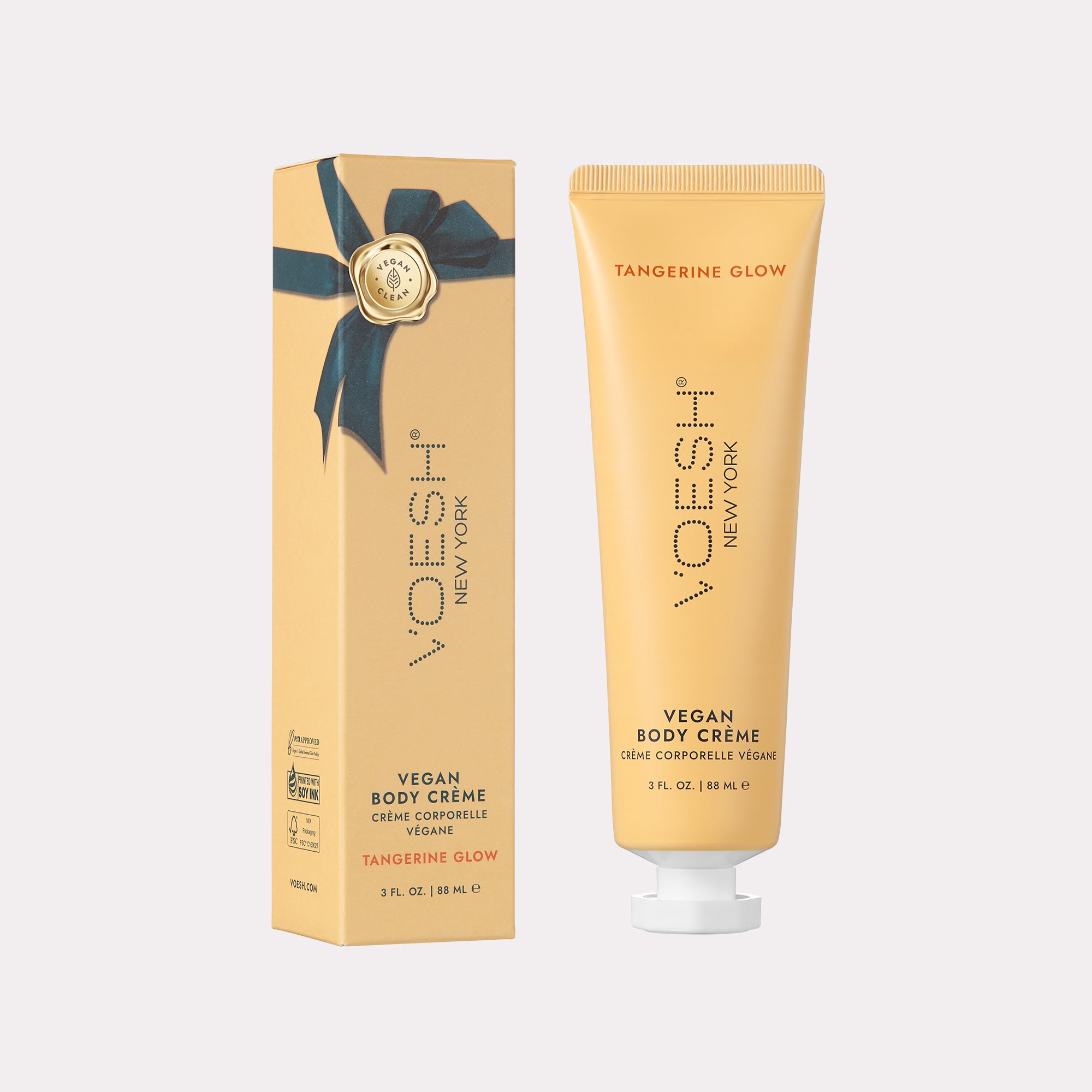 Vegan Body Crème Tangerine Glow next to box packaging on a white background.